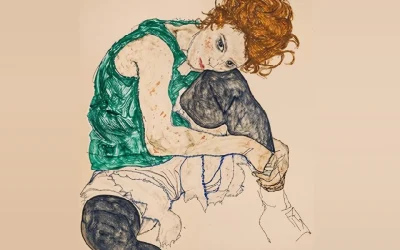 seated-woman-resting-her-cheek-on-her-knee_960x720