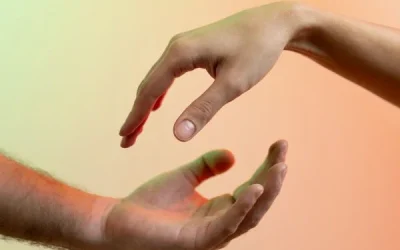 Two hands approaching each other, palm to palm