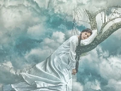 woman sleeping on a tree